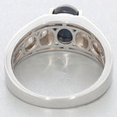 View of the interior design of an oval black spinel sterling silver ring with intricate detailing.